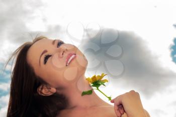 Royalty Free Photo of a Woman with a Flower