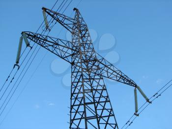 Royalty Free Photo of a Powerline Tower Against a Blue Sky