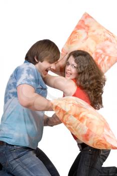Royalty Free Photo of a Couple Having a Pillow Fight