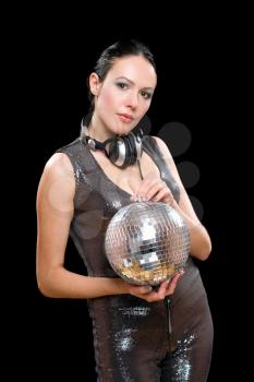 Portrait of attractive woman with a mirror ball in her hands. Isolated on black