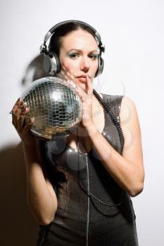 Portrait of nice brunette with a mirror ball in her hands