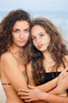 Portrait of two girls on the beach