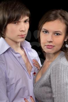 Closeup portrait of a young loving couple. Isolated