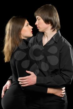 Portrait of a young sensual loving couple. Isolated