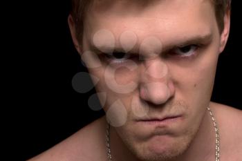 Closeup portrait of a furious young man. Isolated