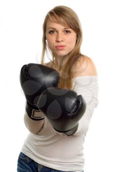 Charming young woman in white blouse with black boxing gloves. Isolated