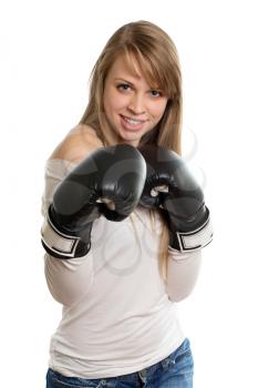 Joyful blond lady posing with black boxing gloves. Isolated on white 