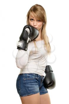 Attractive young lady kissing boxing glove. Isolated on white