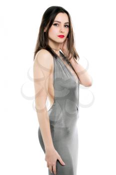 Pretty slim woman wearing sexy grey dress. Isolated on white 
