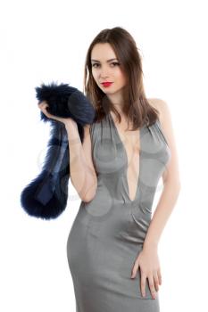 Playful lady posing in grey dress with fur. Isolated on white