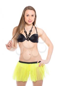 Sexy young woman posing in black bra and yellow skirt. Isolated on white