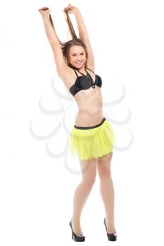 Crazy young woman posing in black bra and yellow skirt. Isolated on white