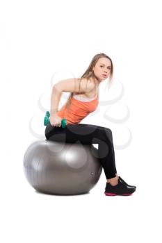 Young blonde training with dumbbells. Isolated on white