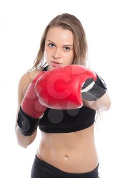 Pretty woman boxing in the studio. Isolated on white
