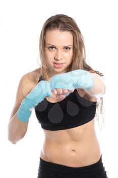 Portrait of pretty young woman boxing. Isolated on white