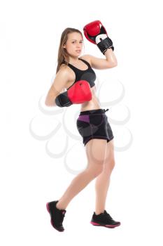 Young blonde wearing big red boxing gloves. Isolated on white