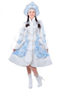 Young brunette posing in an embroidered winter costume. Isolated on white
