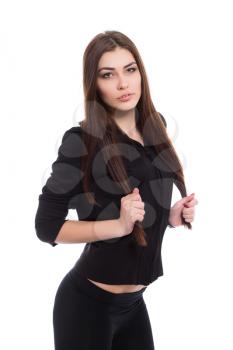 Portrait of playful brunette wearing black clothes. Isolated on white
