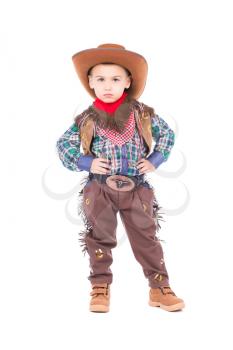 Little boy wearing cowboy suit. Isolated on white