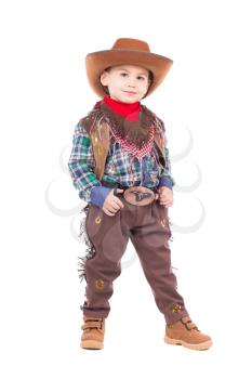Beautiful little boy posing in cowboy costumes. Isolated on white
