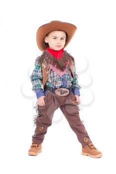 Funny little boy wearing cowboy suit. Isolated on white