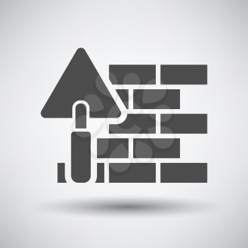 Brick wall with trowel icon on gray background with round shadow. Vector illustration.