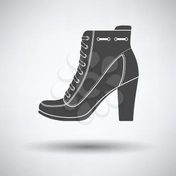 Ankle boot icon on gray background with round shadow. Vector illustration.