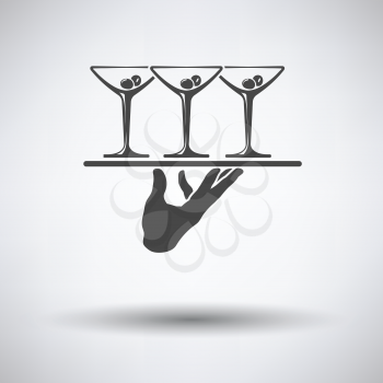 Waiter hand holding tray with martini glasses icon on gray background with round shadow. Vector illustration.
