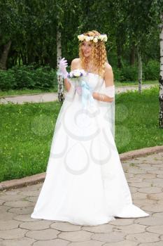 Royalty Free Photo of a Bride Holding a Bouquet