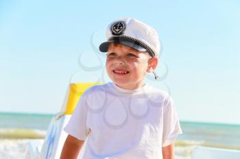 Royalty Free Photo of a Little Boy Wearing a Sailor Hat