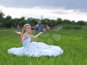 Royalty Free Photo of a Bride Sitting Outside