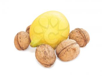 Royalty Free Photo of a Lemon and Walnuts