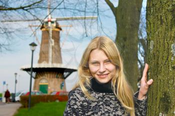 Girl near  windmill in  Dutch town of Gorinchem. Netherlands