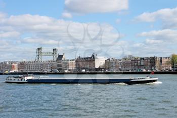 Barge on  backdrop of  waterfront of Rotterdam. Netherlands 