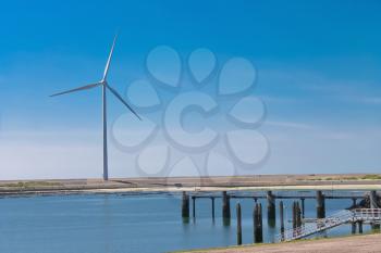 Dutch landscape. Wind turbines on the lake