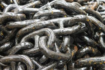 The new black anchor chain in stock shipyard