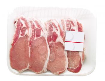 Pork chops packaged in a container with a price tag