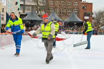 Workers removes snow on the rink in the Dutch city of Eindhoven. Netherlands