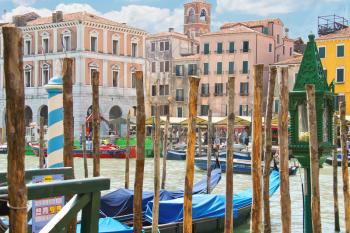 VENICE, ITALY - MAY 06, 2014: Berth pillars of  Gondola Service on the Grand Canal in Venice, Italy