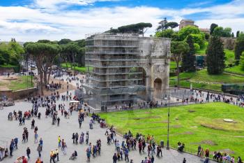 ROME, ITALY - MAY 04, 2014: Tourists in square near the Triumphal Arch of Constantine in Rome, Italy 