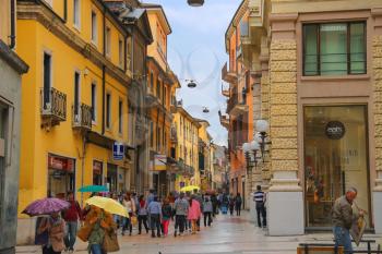 VERONA, ITALY - MAY 7, 2014: People in the street on a rainy day, Verona Italy