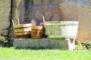 Wooden buckets and tubs in the courtyard of fortresses Guaita on Mount Titan. The Republic of San Marino