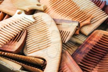 Lots of hand made wooden comb closeup
