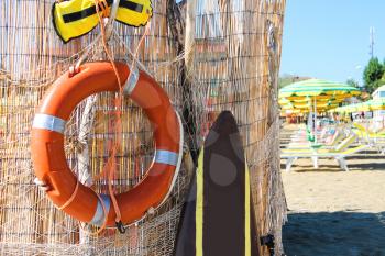 Safety equipment on the beach. Lifebuoy and belt