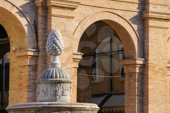 Ancient fountain with pinecone on Cavour square in Rimini, Italy