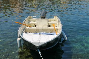 Motor boat anchored in the small port on Elba Island, Italy.