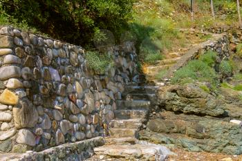 Stone stairs on the coast of the Tyrrhenian Sea, Marciana Marina on Elba Island, Italy