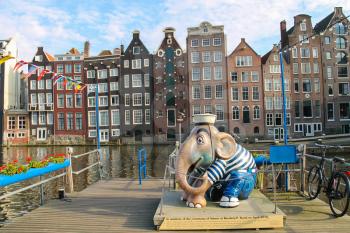 Amsterdam, the Netherlands - October 03, 2015: Sculpture of elephant sailor at berth near the water in city centre