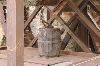 Old style wooden well with bucket. Mukachevo, Ukraine