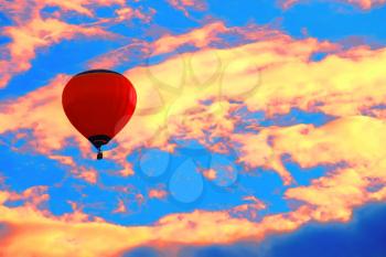 Bright balloon in sunset colorful sky